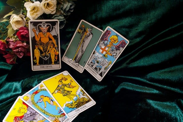 I will perform a tarot reading or rune cast for your guidance