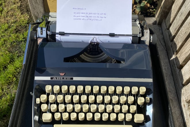 I will type your text with my typewriter in cursive font